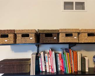Woven storage baskets, books