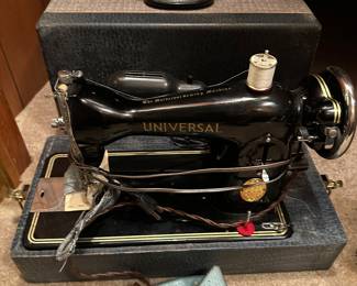 Universal sewing machine w/ case.
