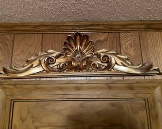 Gilt overdoor embellishment.