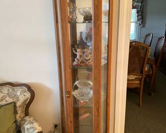 Handsome four-shelf curio cabinet.