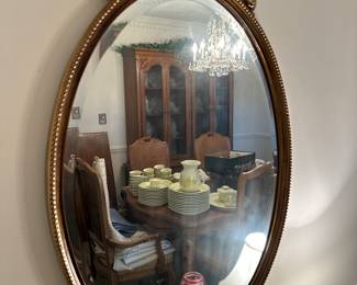 Beveled oval mirror.