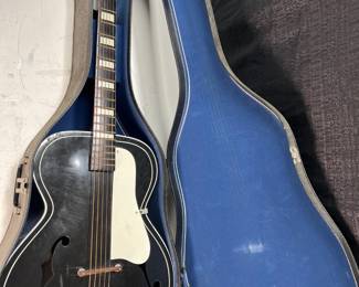 Lot 158
Vintage Silvertone 658 Tuxedo Archtop Acoustic Guitar With original case and strap, f holes