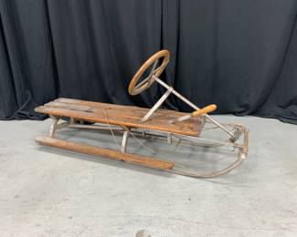 Lot 20
Fridtjof Nansen Antique Toboggan Sled. Steering works, metal and wood showing their age, but minimal rotting.