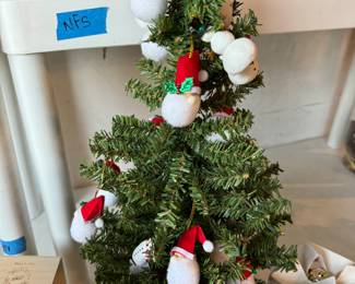 tiny tree with santas 