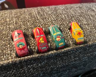 4 Tin Toy Cars.
