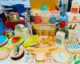 Fiesta pottery, new in box arcadia canisters in white and colored seet, new Texas and western wood cutting boards, we have a big collection of nice new boards