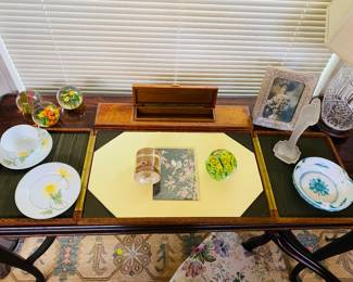 rich burled maple wood writing desk is shown open here, butterfly paper weight, crystal lamp (we have a pair) vintage arcrylic paperweights are super fun