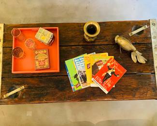 Incredible ships hatch door coffee table, brass cased ends and hardware. Rich patina, organic with a little history .
Vintage large brass koi fish. 1970s NOLA Jazz Fest guides, mod gilt glassware,