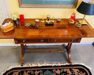 Style and  function. This is a gorgeous rolling antique desk with folding sides. Rich and in  beautiful condition