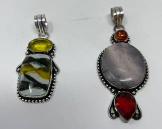 Left to Right

Dichroic Glass • Citrine • Sterling Pendant

Phosphosiderite • Amber • Garnet • Sterling Pendant 