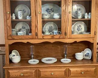 Love this piece!  Reminds me of the original “icebox”… love the doors!  Dishes or your collection of Nascars,  vases, teacups, skulls or Barbies…