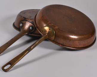 Another view of pair of copper frying pans