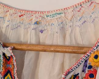 Closeup of women's white blouse, hand-embroidered, made in Hungary, size 44