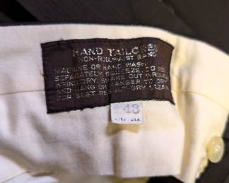 Closeup interior waistband from suit with single-button closure blazer, vest and trousers, size 43