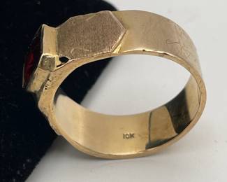 Closeup of 10kt gold men's ring with rectangular garnet