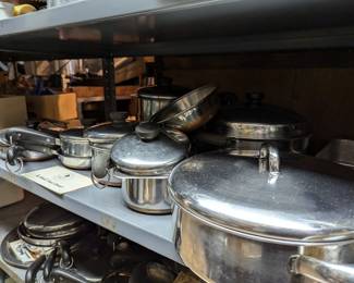 Many pieces of Revere Ware - lidded saucepans, frying pans, and more