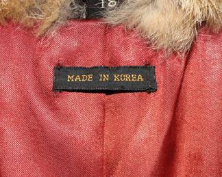 Labels inside real fur coat with leather belt, size 18, Made in Korea