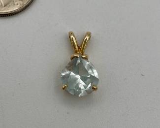 14kt gold pendant with pear-shaped blue stone