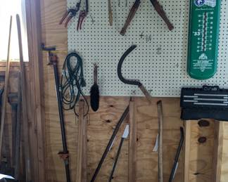 Tools including shears, axes, pickaxe, sickle, crowbars
