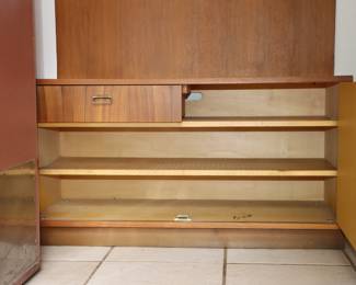 Closeup of hall / entryway unit with mirror, coat rack, shelf, cabinets