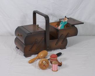 Incredible vintage wooden fold-out sewing box, with handle; includes wooden darning eggs, pincushion, awl, and a wee doll. 