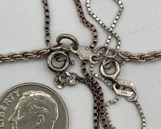 Closeup of Sterling silver chain necklaces of different lengths
