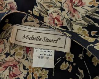 Closeup of Michelle Stuart women's belted floral print dress, size 12