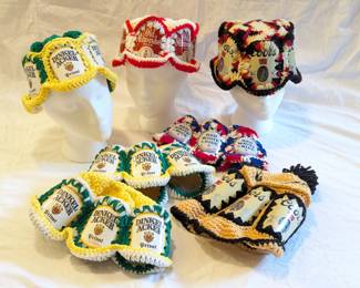 Crocheted hats with panels from Dinkelacker, Old Milwaukee, and Coors Beer cans