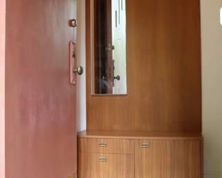 Another view of hall / entryway unit with mirror, coat rack, shelf, cabinets