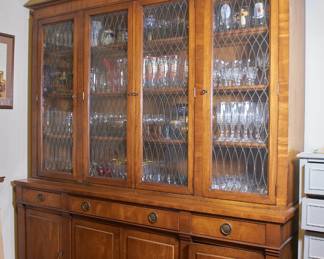 Beautiful large display/storage cabinet, polished wood, shelving behind glass doors, with drawers and cabinets in the base
