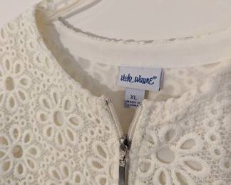 Closeup of Vicki Wayne women's zippered cream-color cut out / lace cardigan, size XL