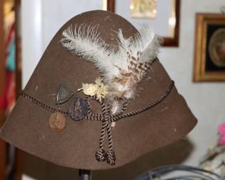 Vintage wool hat with feather with pins and medals, European