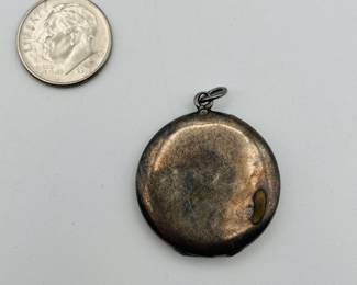 Reverse side of antique silver floral guilloche enamel locket with roses