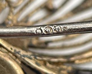 Closeup of silver mark on vintage silver filigree butterfly brooch