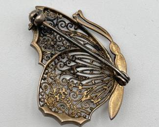Reverse of vintage silver filigree butterfly brooch