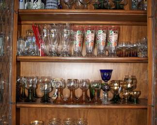 Just part of a selection of vintage glassware - wine glasses, cocktail glasses, champagne flutes, beer steins, and more!