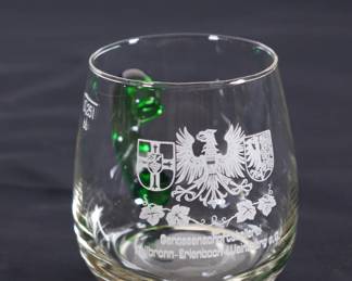 Closeup of German liquor glasses clear & green handles 