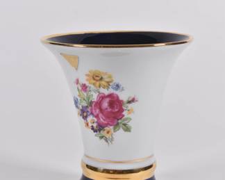 Royal Dux porcelain trumpet vase with blue and gold rims and borders and floral decoration. It has the famous Royal Dux pink clay applied triangle. Made in former Czechoslovakia in the 1960's.