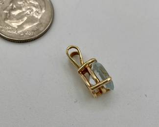 Another view of 14kt gold pendant with pear-shaped blue stone