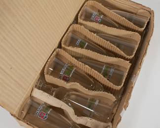 Another view of box of 8 clear DinkelAcker Export Bier branded beer glasses