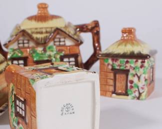 Base of creamer from vintage 1940’s thatched roof house tea set made in Occupied Japan; includes teapot, creamer, lidded sugar dish and lidded butter dish