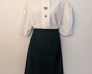 Women's embroidered white blouse and black skirt
