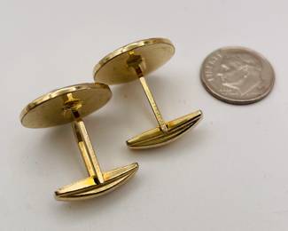 Another view of pair of cufflinks, gold tone metal, in circular fan shape with pearls