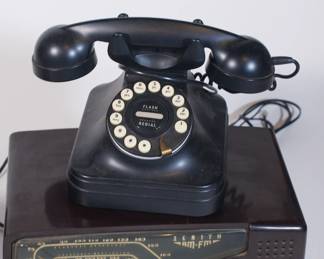 Another closeup of vintage radio (1940s Zenith AM/FM radio - rare model with an Eagle crest instead of the traditional Zenith crown emblem) and vintage black Grand Phone Flash Redial PF Products landline phone
