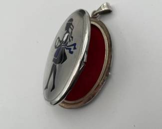 Vintage silver locket with young girl's silhouette on front