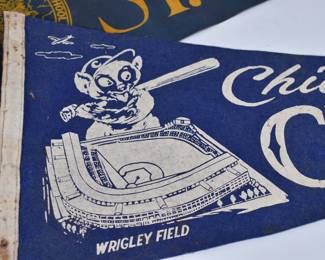 Closeup of vintage Chicago Cubs Wrigley Field pennant and St. Michael Central High School pennant 
