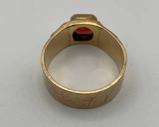 Closeup of 10kt gold men's ring with rectangular garnet