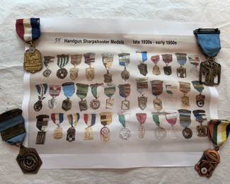 Some of the late 1930s - early 1950s handgun sharpshooter medals shown with an illustrated color print of medals from that era
