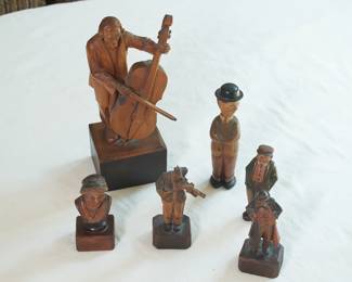 Carved wooden figurines including musicians