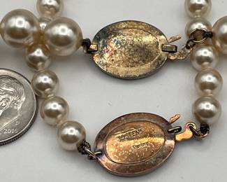 Closeup of Jostens Faux Pearl necklace and bracelet with sterling silver clasps
